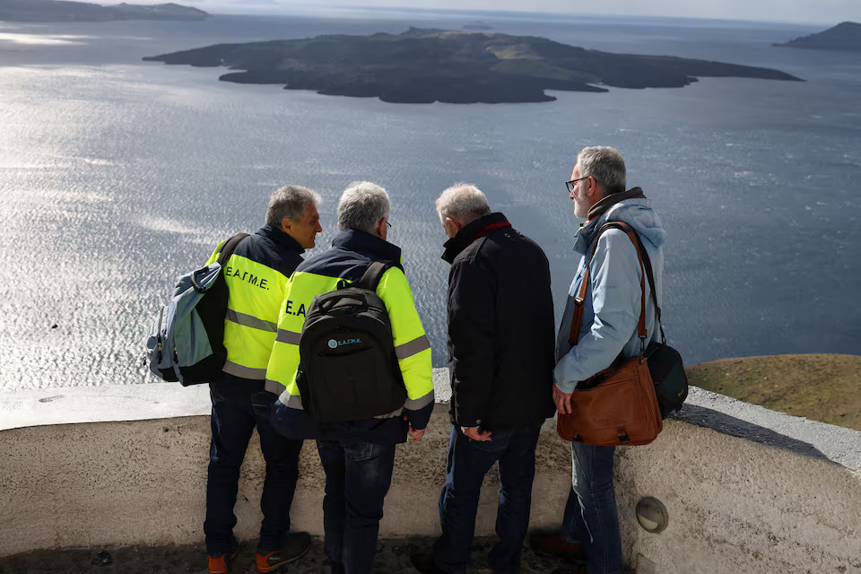 [6/9]Geologists and professor of tectonic geology Efthymios Lekkas asses the dangers in the village of Fira, as the increased seismic activity continues on the island of Santorini, Greece, February 7, 2025. Photo: Reuters