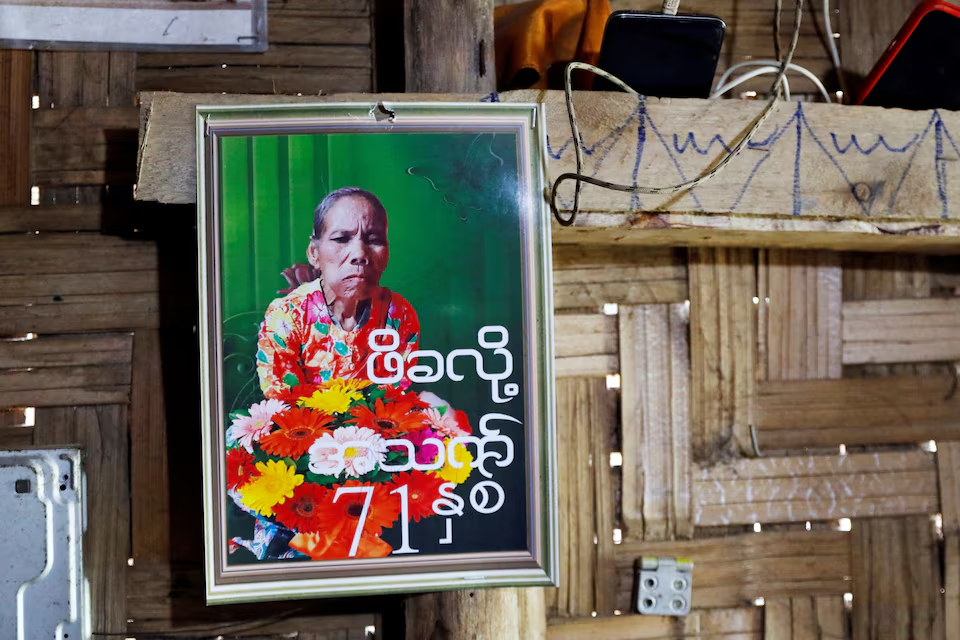 A picture of Pe Kha Lau, 71, a Karen ethnic who passed away on February 2 after being sent back home since the closure of the camp hospital, following a halt in U.S. foreign aid that led to the closure of health services inside Umpiem Mai Refugee Camp nearby on the Thai-Myanmar border, hangs at Phop Phra district, Tak Province, a Thai-Myanmar border province, February 7, 2025. Photo: Reuters