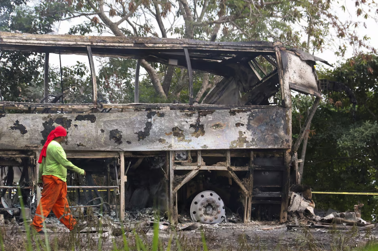 A burned bus is pictured after colliding with a trailer during its journey from Cancun to Tabasco, where people died in the accident, according to local media, near Escarcega, Campeche state in southern Mexico, February 8, 2025. Photo: Reuters