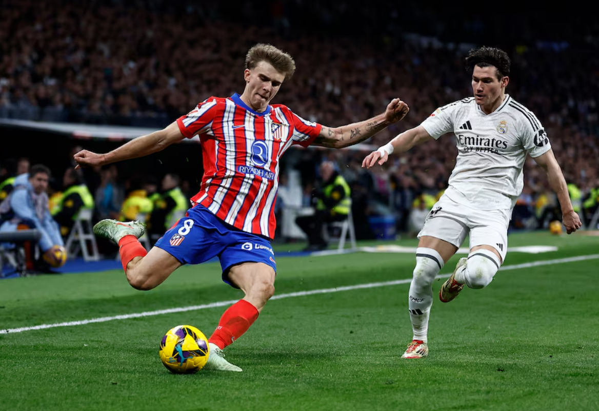 Soccer Football - LaLiga - Real Madrid v Atletico Madrid - Santiago Bernabeu, Madrid, Spain - February 8, 2025 Atletico Madrid's Pablo Barrios in action with Real Madrid's Fran Garcia. Photo: Reuters