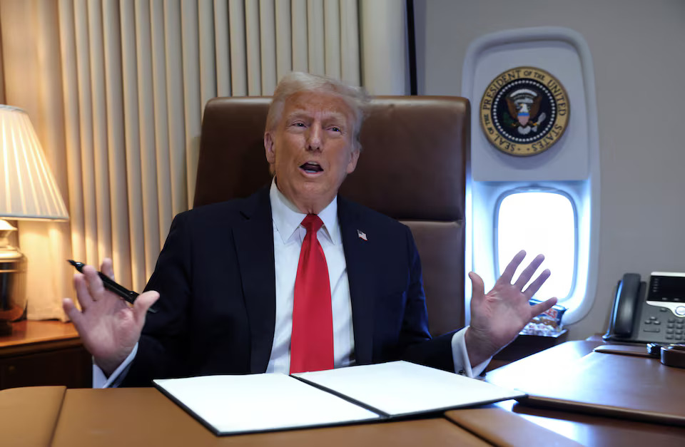 [2/3]U.S. President Donald Trump speaks to reporters before signing a proclamation renaming the Gulf of Mexico to the Gulf of America, while flying over the gulf aboard Air Force One en route to New Orleans to attend the Super Bowl, February 9, 2025. REUTERS/Kevin Lamarque Purchase Licensing Rights, opens new tab