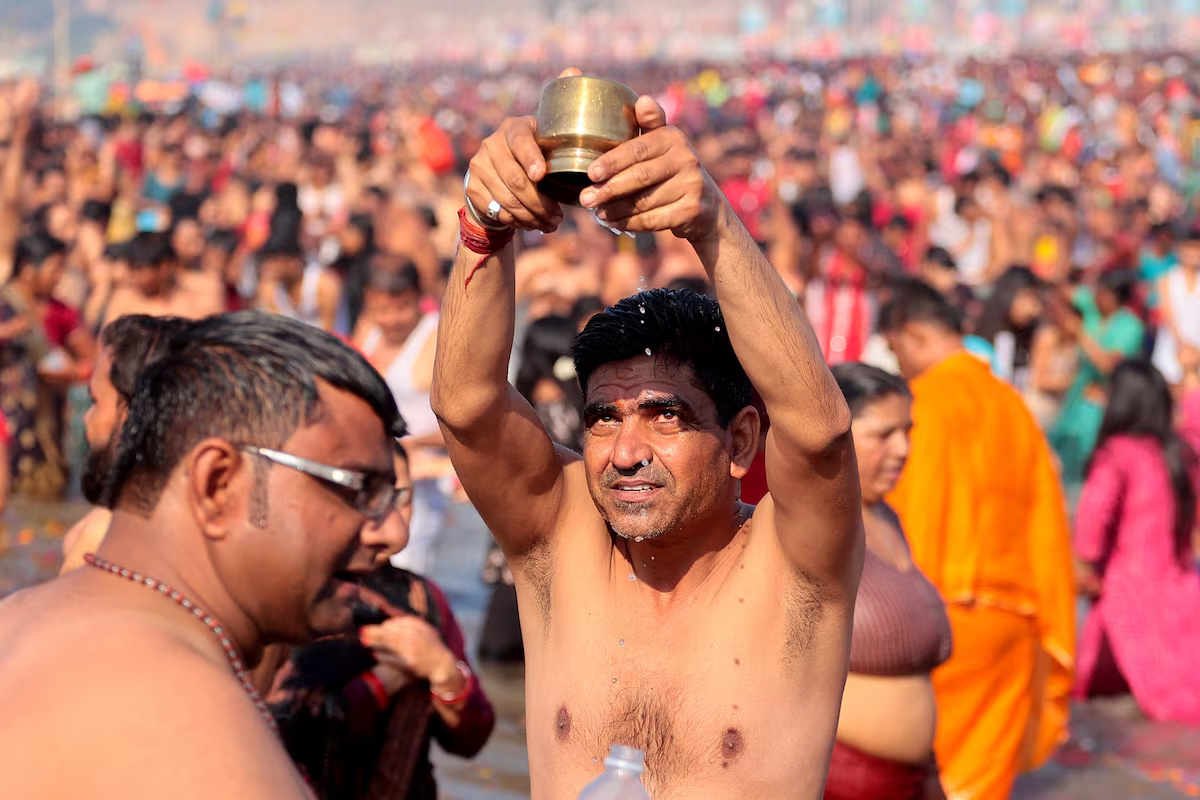 A devotee offers prayers as he takes a dip at Sangam, the confluence of the Ganges and Yamuna rivers with the mythical invisible Saraswati river, to mark Maghi Purnima, one of the auspicious days during the 'Maha Kumbh Mela', or the Great Pitcher Festival, in Prayagraj, India, February 12, 2025. Photo: Reuters