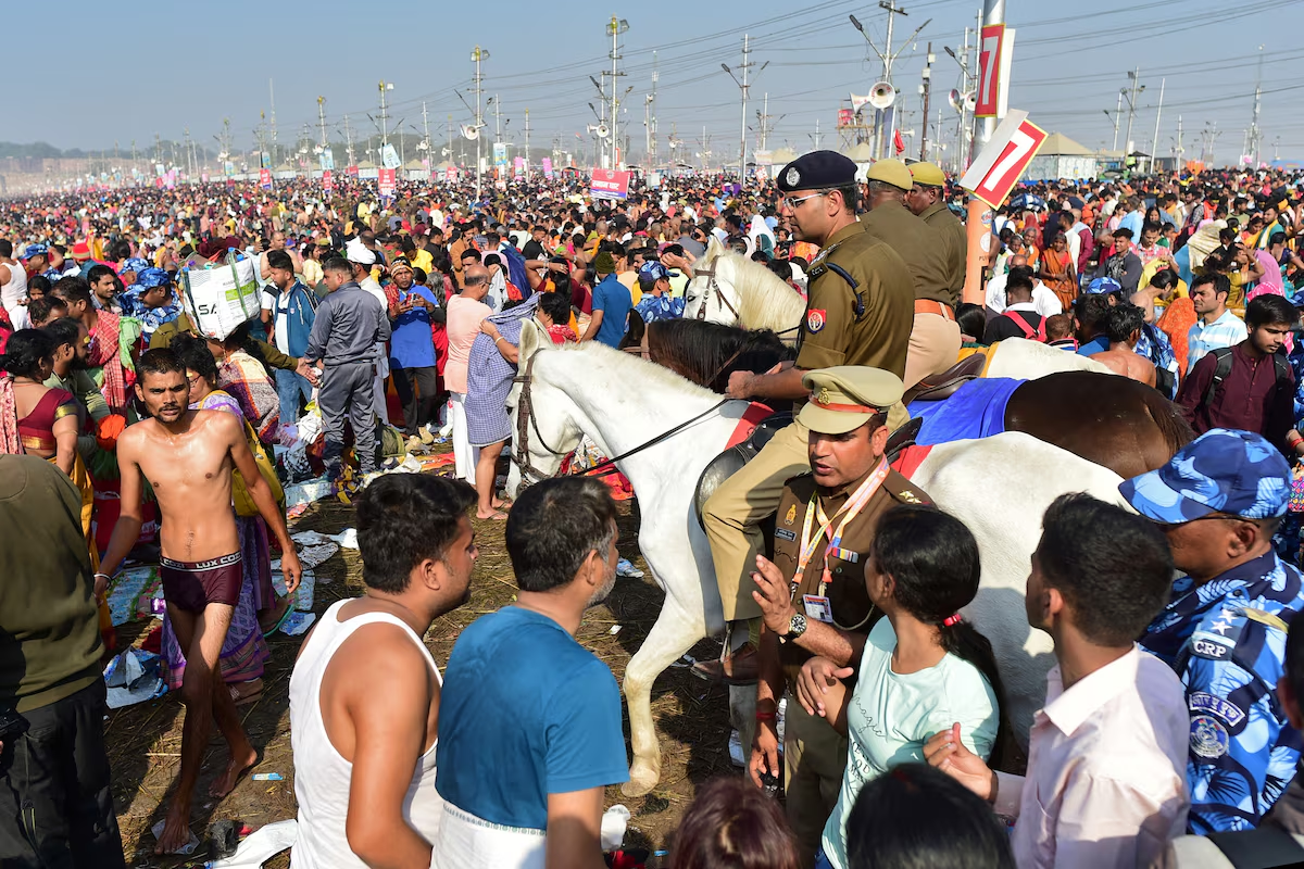 Mounted police officers patrol as devotees gather to take a dip at Sangam, the confluence of the Ganges and Yamuna rivers with the mythical invisible Saraswati river, to mark Maghi Purnima, one of the auspicious days during the 'Maha Kumbh Mela', or the Great Pitcher Festival, in Prayagraj, India, February 12, 2025. Photo: Reuters