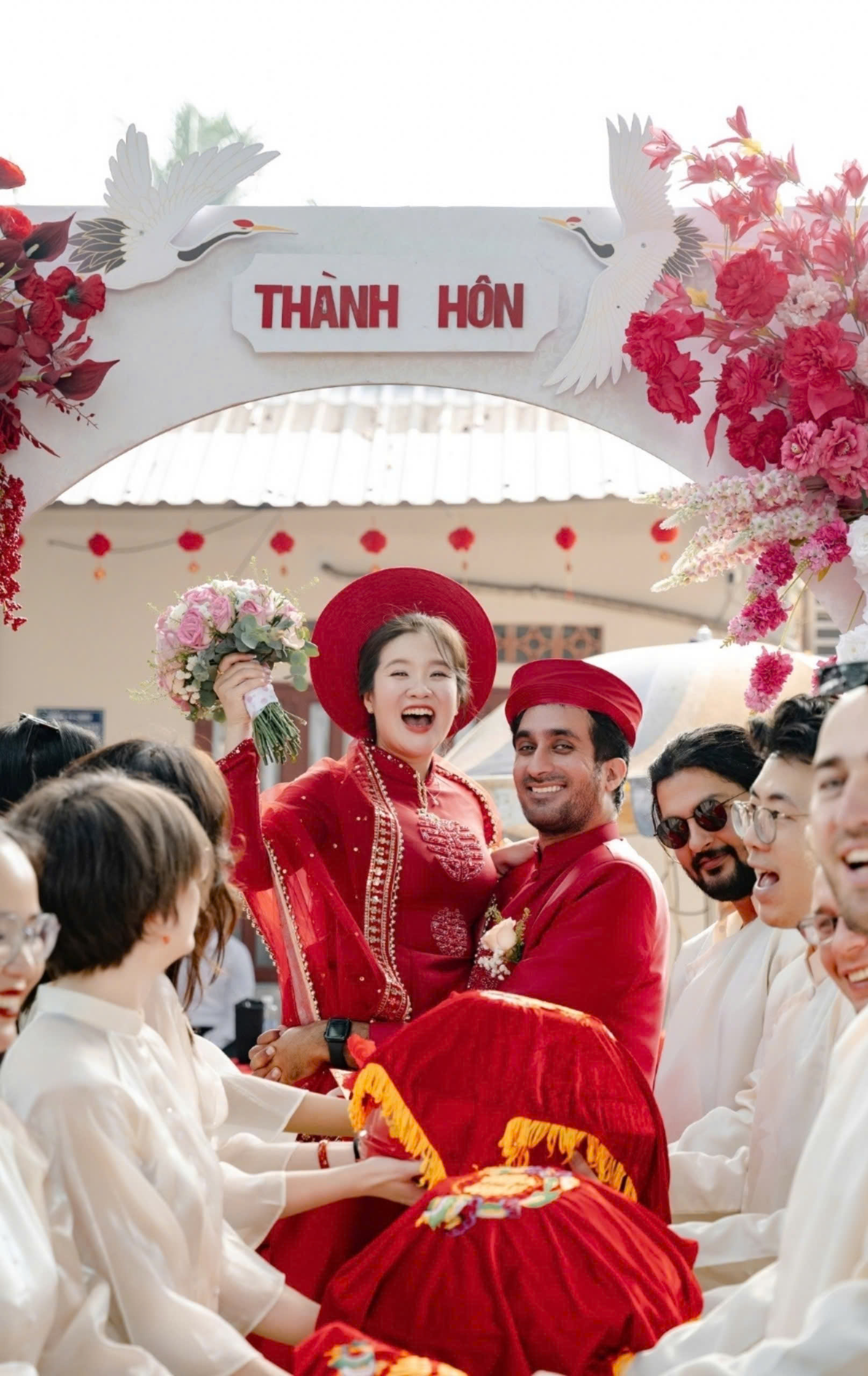 Akshay Sharma and his wife, dressed in Vietnamese traditional áo dài, pose for a photo at their wedding. Photo courtesy of Akshay Sharma.