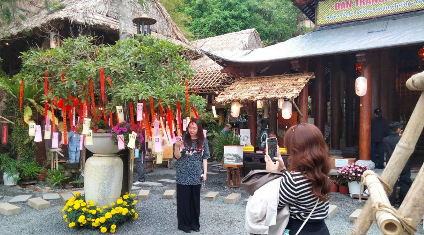 A girl poses for a photo at Tu Tam Pagoda at the Ngu Hanh Son (Marble) Mountains in Da Nang City, central Vietnam. Photo: Thao Nhi / Tuoi Tre