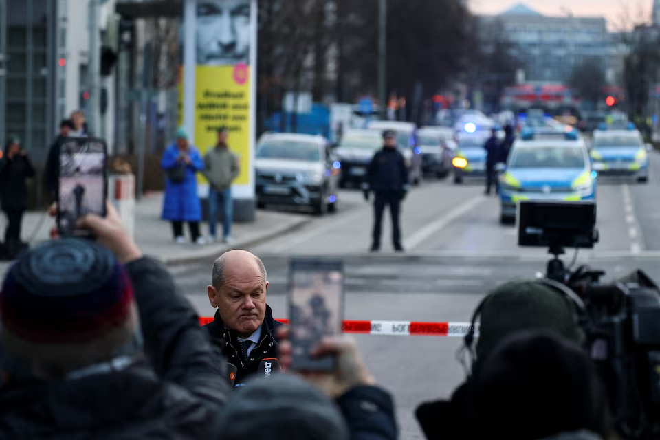 German Chancellor Olaf Scholz speaks to the media near the site of a suspected ramming attack where a 24-year-old Afghan asylum seeker drove a car into a crowd, as the Munich Security Conference (MSC) takes place in Munich, Germany, February 15, 2025. Photo: Reuters