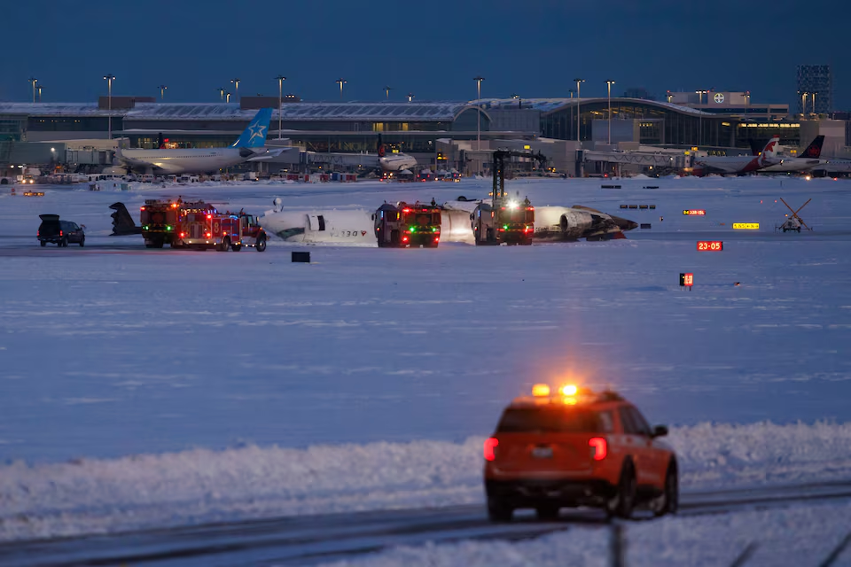 Emergency responders operate around a plane on a runway after a plane crash at Toronto Pearson International Airport in Mississauga, Ontario, Canada February 17, 2025. Photo: Reuters