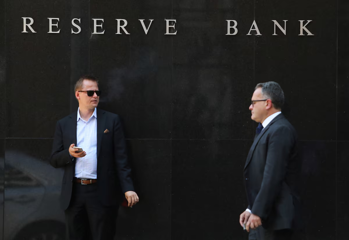 Australia's central bank cuts rates, cautious on further easing