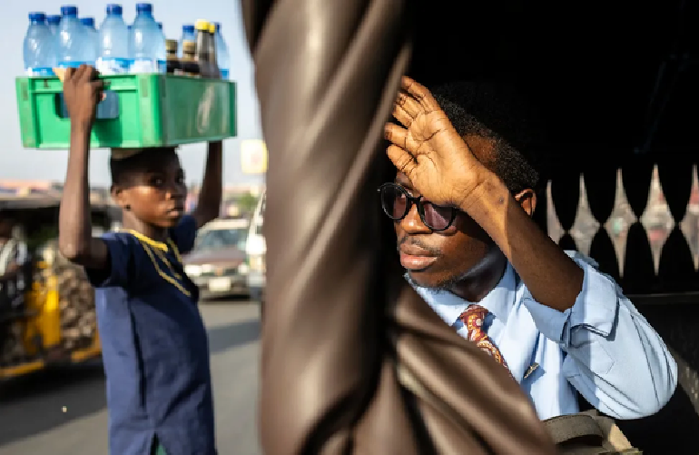 Covenant Odedele (right), in a tuk-tuk in Ibadan, Nigeria. Photo: AFP