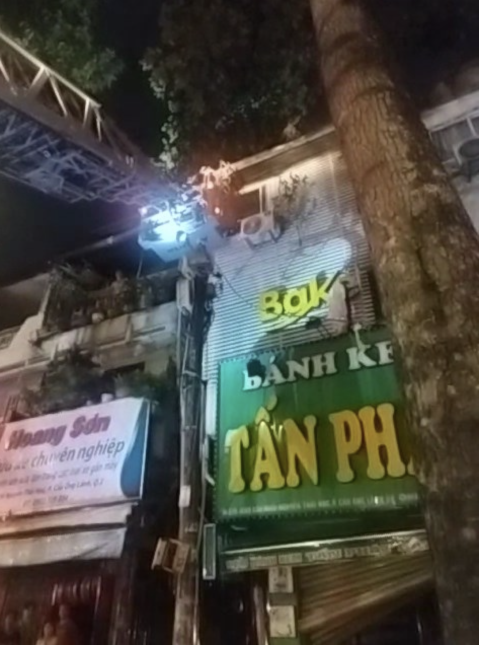 A ladder truck is used for rescue efforts at a fire at a bakery in downtown Ho Chi Minh City. Photo: Supplied