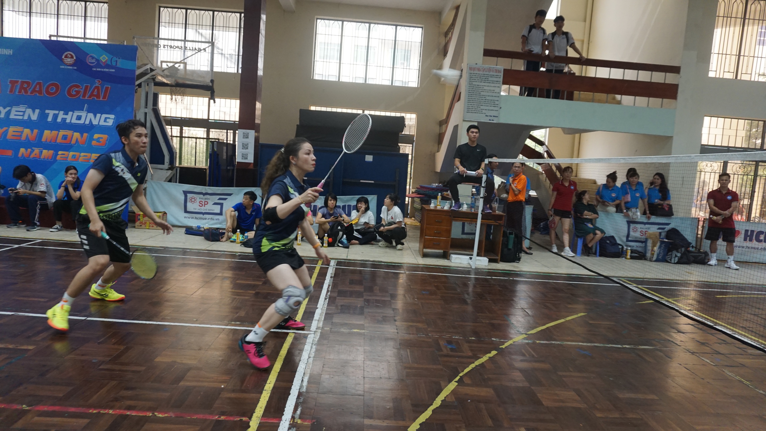 Teachers compete in a badminton tournament at the sports hall of the University of Education in Ho Chi Minh City. Photo: My Dung / Tuoi Tre