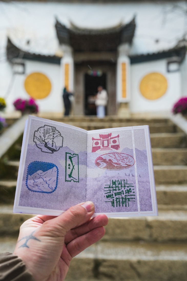 A tourist shows the ‘Ha Giang Passport’ at Hmong King Palace in Dong Van District, Ha Giang Province, northern Vietnam. Photo: Supplied