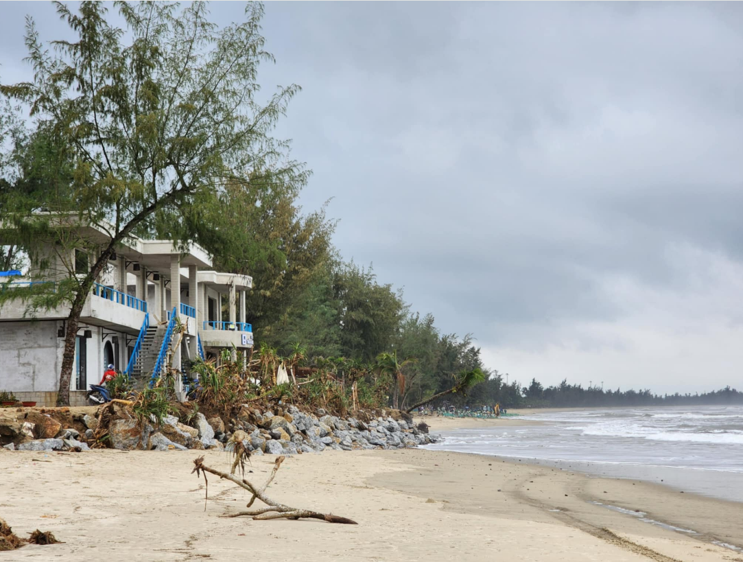 A restaurant blocks the rising tide with stone barriers.