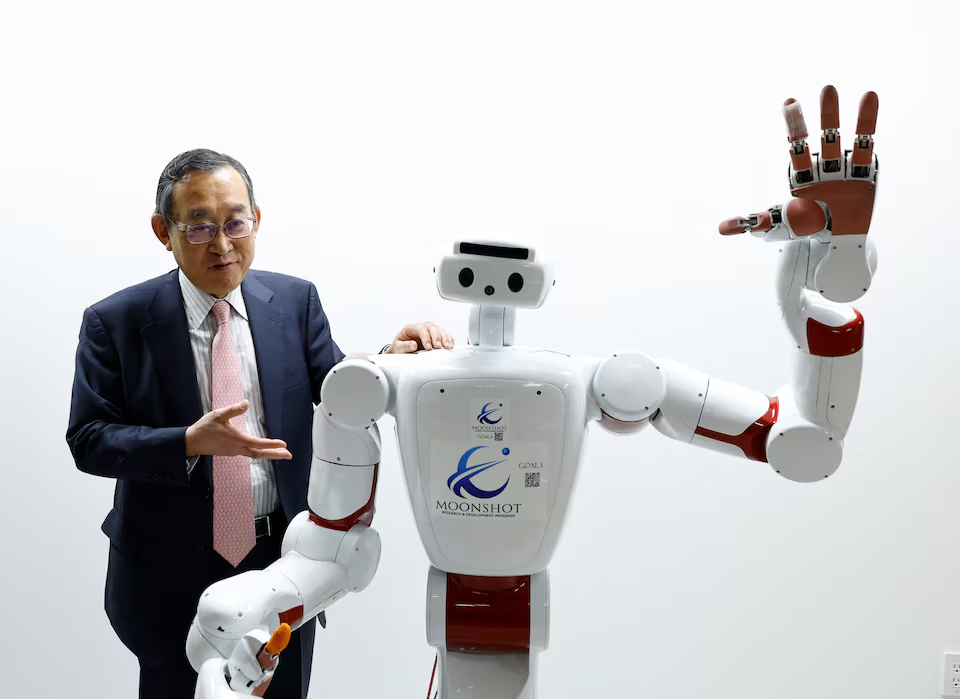 Waseda University professor Shigeki Sugano talks about AIREC, an artificial intelligence (AI)-driven humanoid robot, at the university's laboratory in Tokyo, Japan February 17, 2025. Photo: Reuters