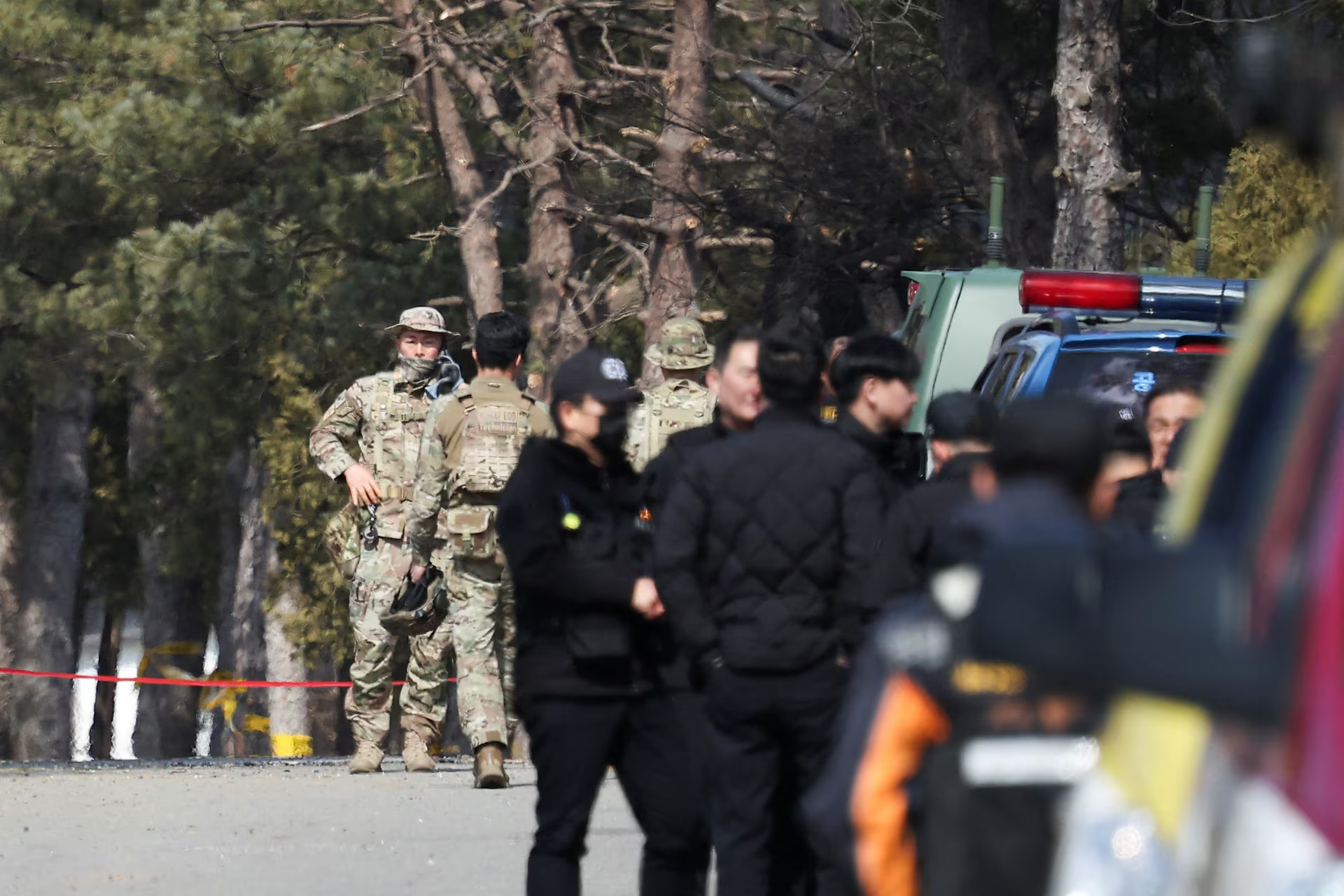 Members of the Explosive Ordnance Disposal (EOD) team stand after Mk82 bombs fell outside the shooting range during joint live-fire exercises near the demilitarized zone separating two Koreas in Pocheon, South Korea, March 6, 2025. Photo: Reuters