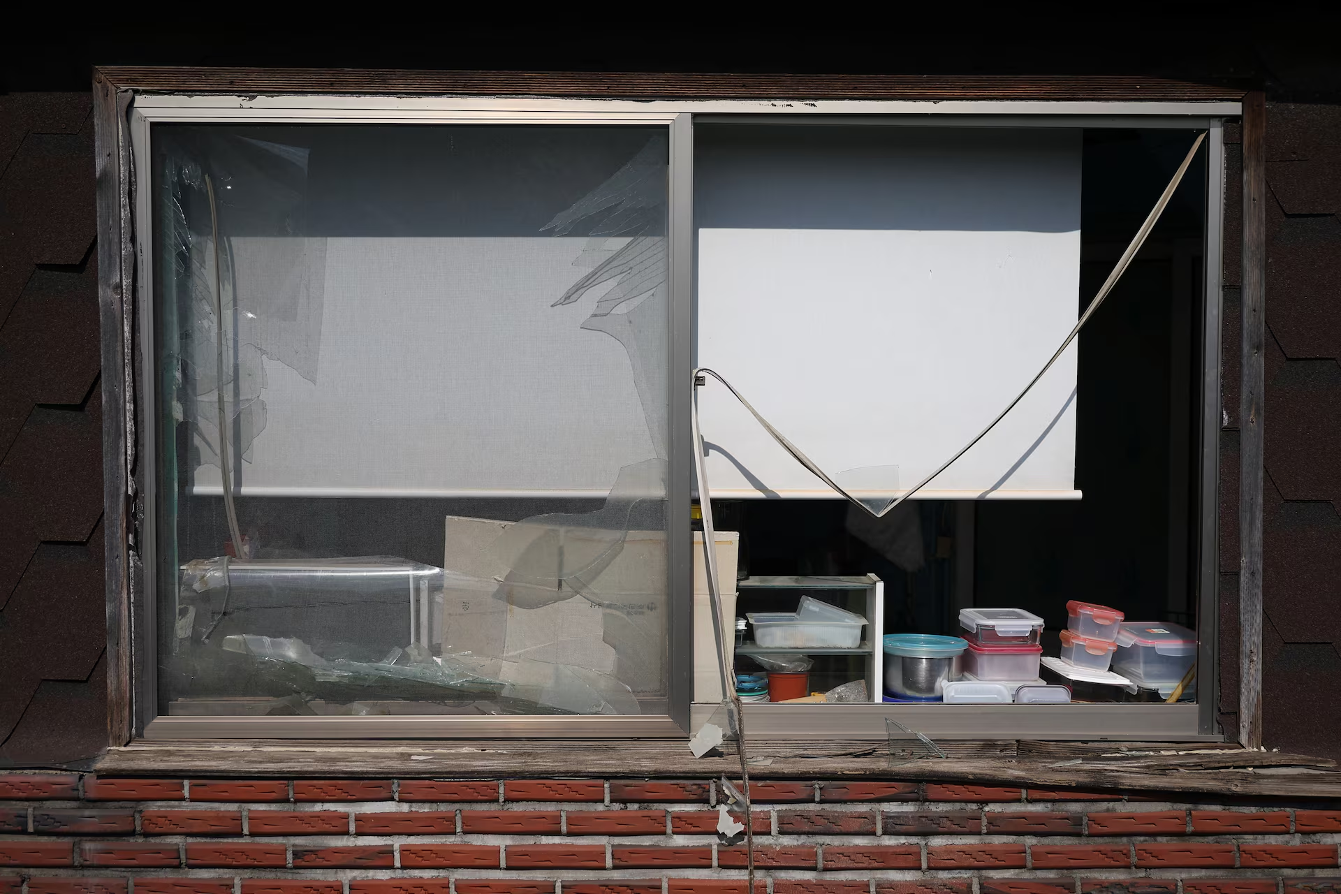 Shards of glass remain on damaged window of a house after Mk82 bombs fell outside the shooting range during joint live-fire exercises near the demilitarized zone separating two Koreas in Pocheon, South Korea, March 6, 2025. Photo: Reuters