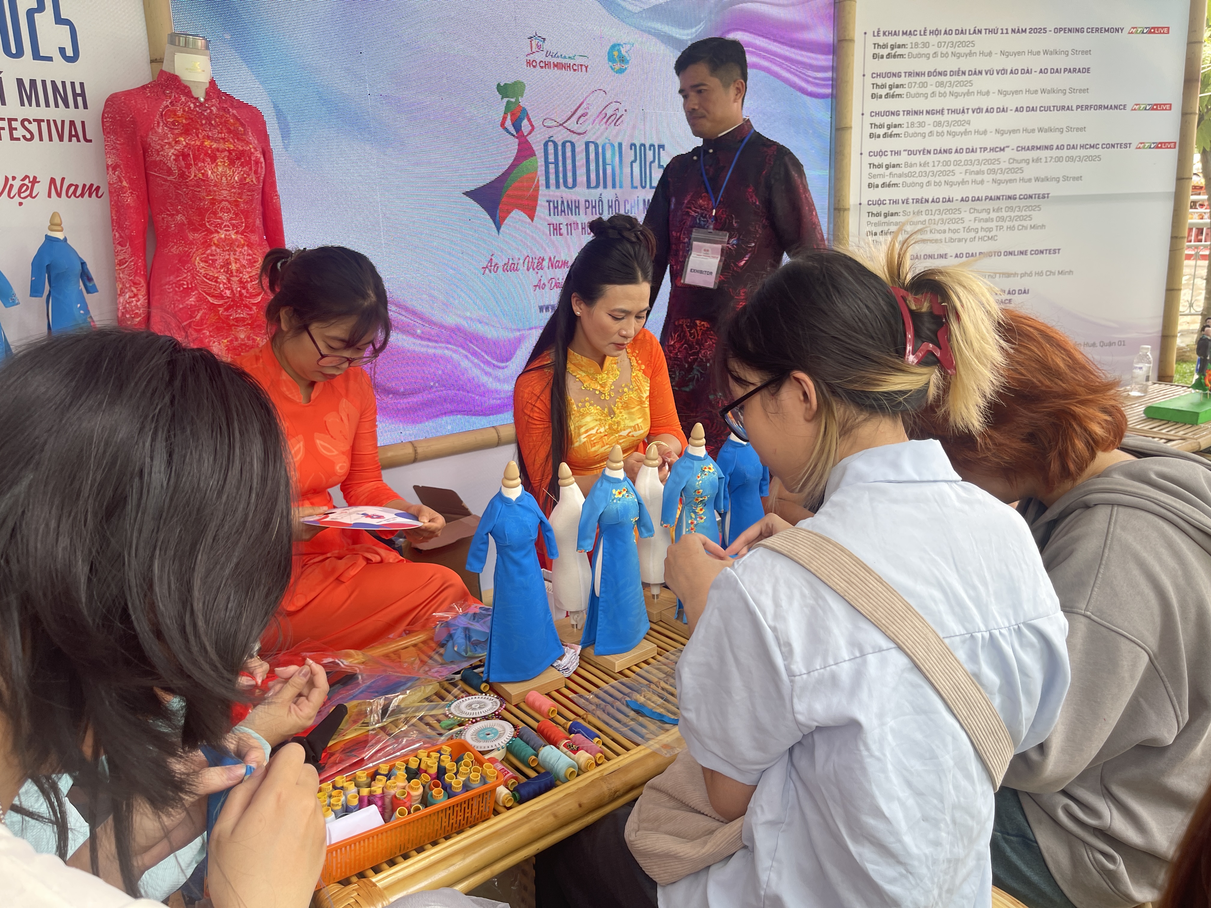 Visitors learn to make miniature áo dài (Vietnamese traditional costume) at a booth at the 10th Japan Vietnam Festival in Ho Chi Minh City on March 8, 2025. Photo: Dong Nguyen / Tuoi Tre News