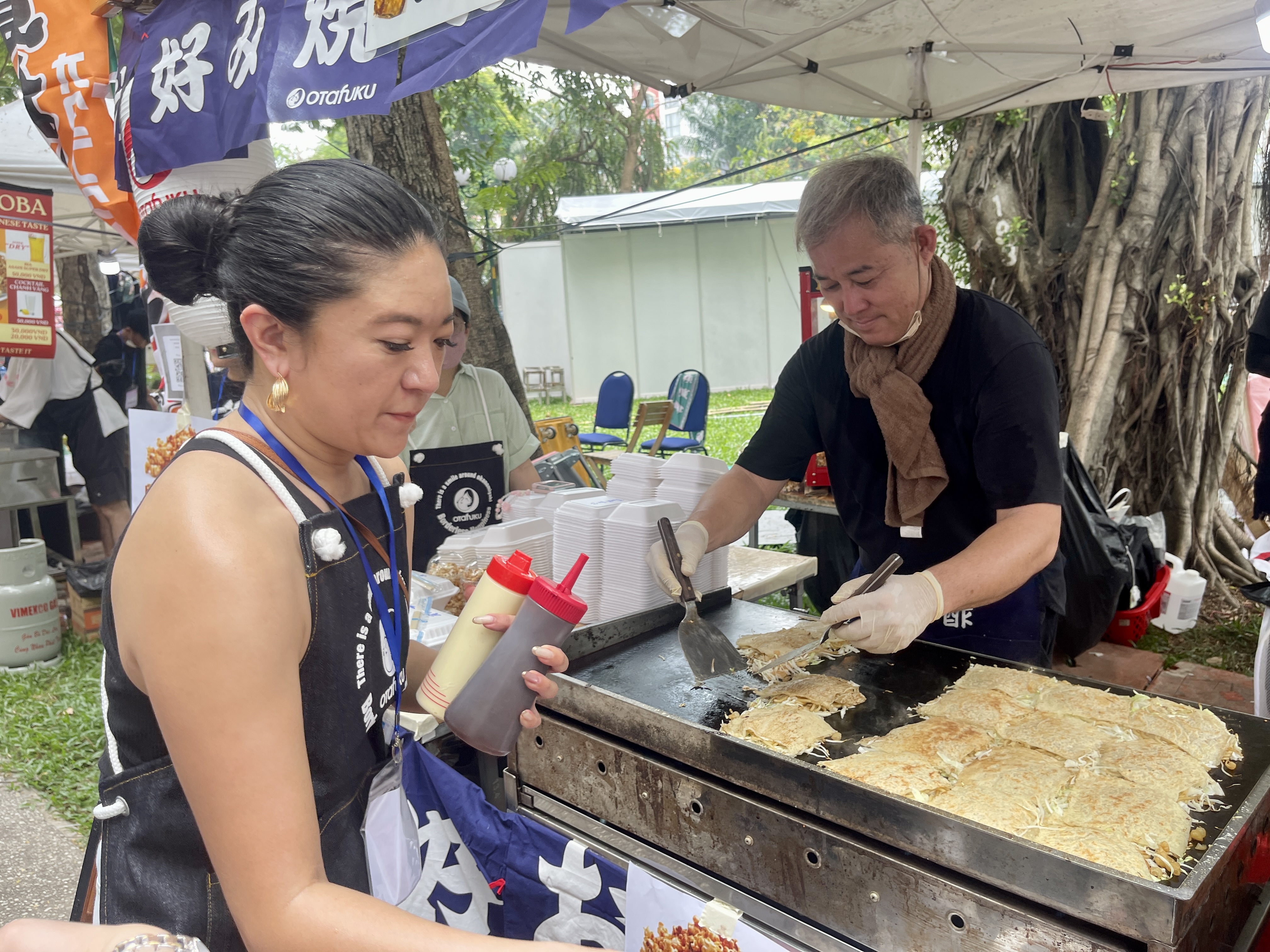 Japanese food is prepared at a booth at the 10th Japan Vietnam Festival in Ho Chi Minh City on March 8, 2025. Photo: Dong Nguyen / Tuoi Tre News