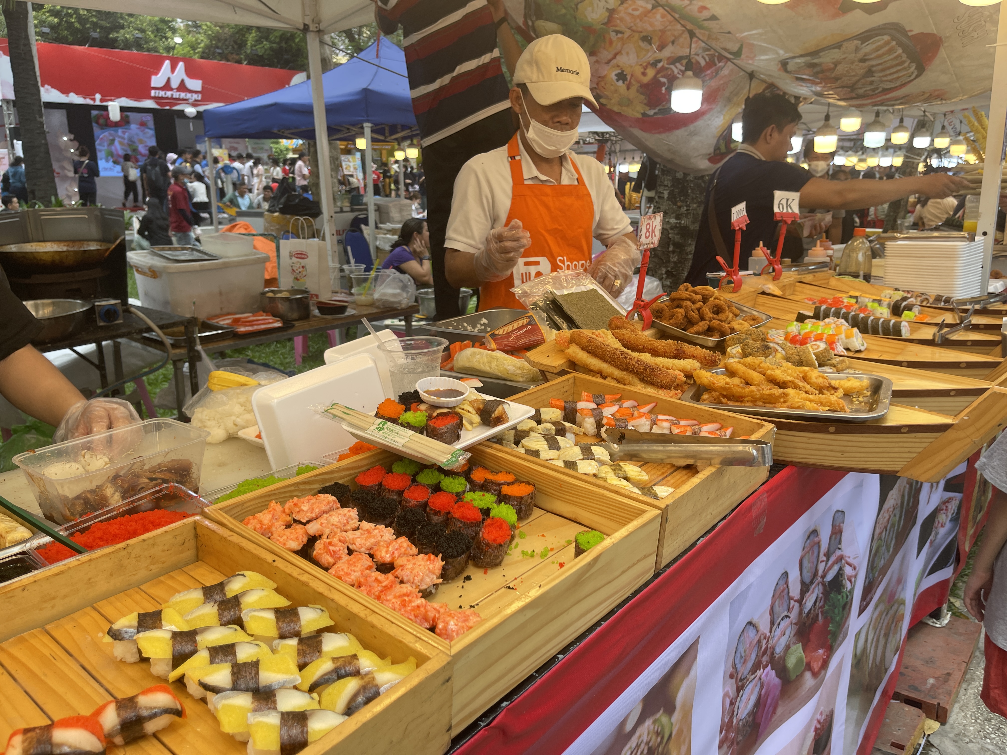 Sushi rolls are prepared at a booth at the 10th Japan Vietnam Festival in Ho Chi Minh City on March 8, 2025. Photo: Dong Nguyen / Tuoi Tre News