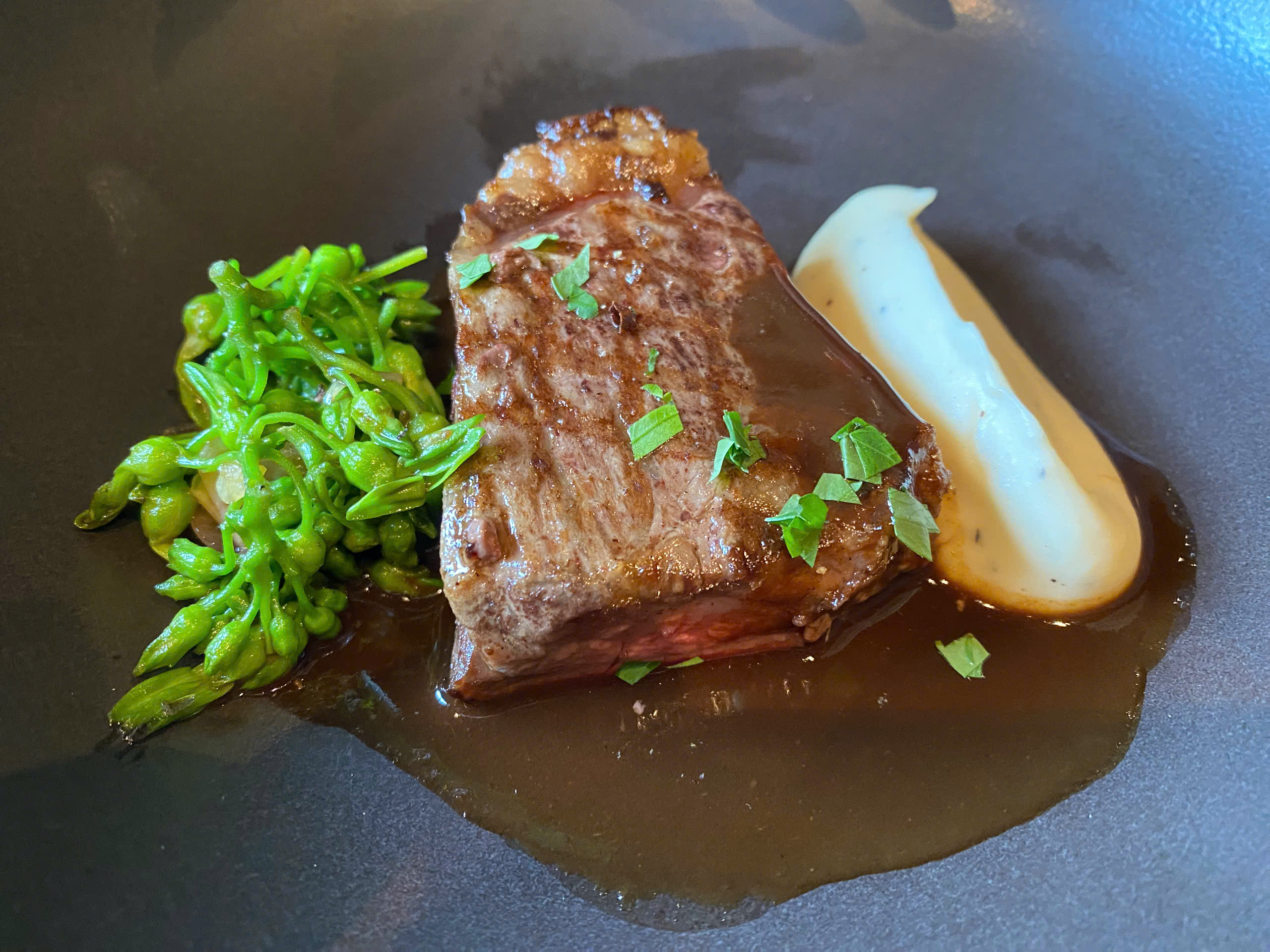 A dish made from Australian wagyu, lotus seed & truffle aioli mash, sauteed tonkin flowers, red wine and Pho sauce. Photo: Tran Phuong / Tuoi Tre