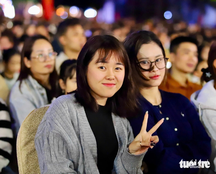 Two young girls pose for a photo at the opening ceremony of the ninth Buon Ma Thuot Coffee Festival 2025 in Buon Ma Thuot City, Dak Lak Province, in Vietnam’s Central Highlands on March 10, 2025. Photo: The The / Tuoi Tre