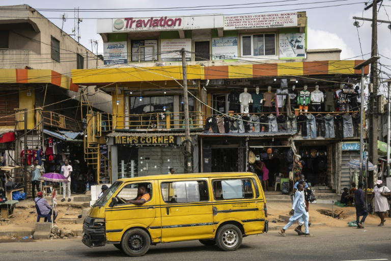 A man drives a Danfo, a mini-bus, in Lagos, on February 21, 2025. Photo: AFP