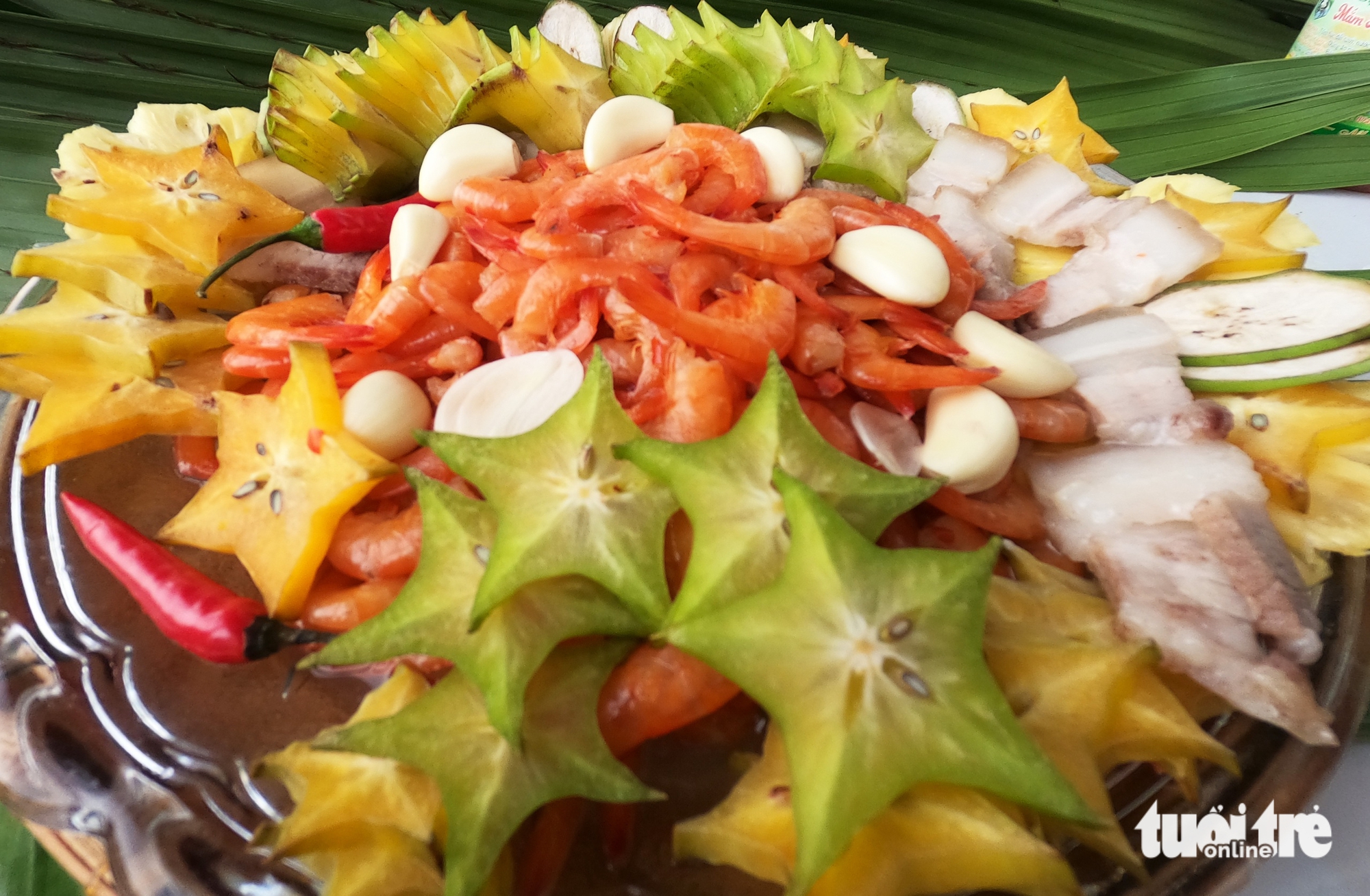 A dish of star fruits and boiled pork belly served with shrimp paste, a specialty of Ca Mau’s mangrove forests. Photo: Thanh Huyen / Tuoi Tre