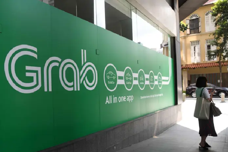 Singapore competition watchdog says no guidance yet on Grab, GoTo merger plans