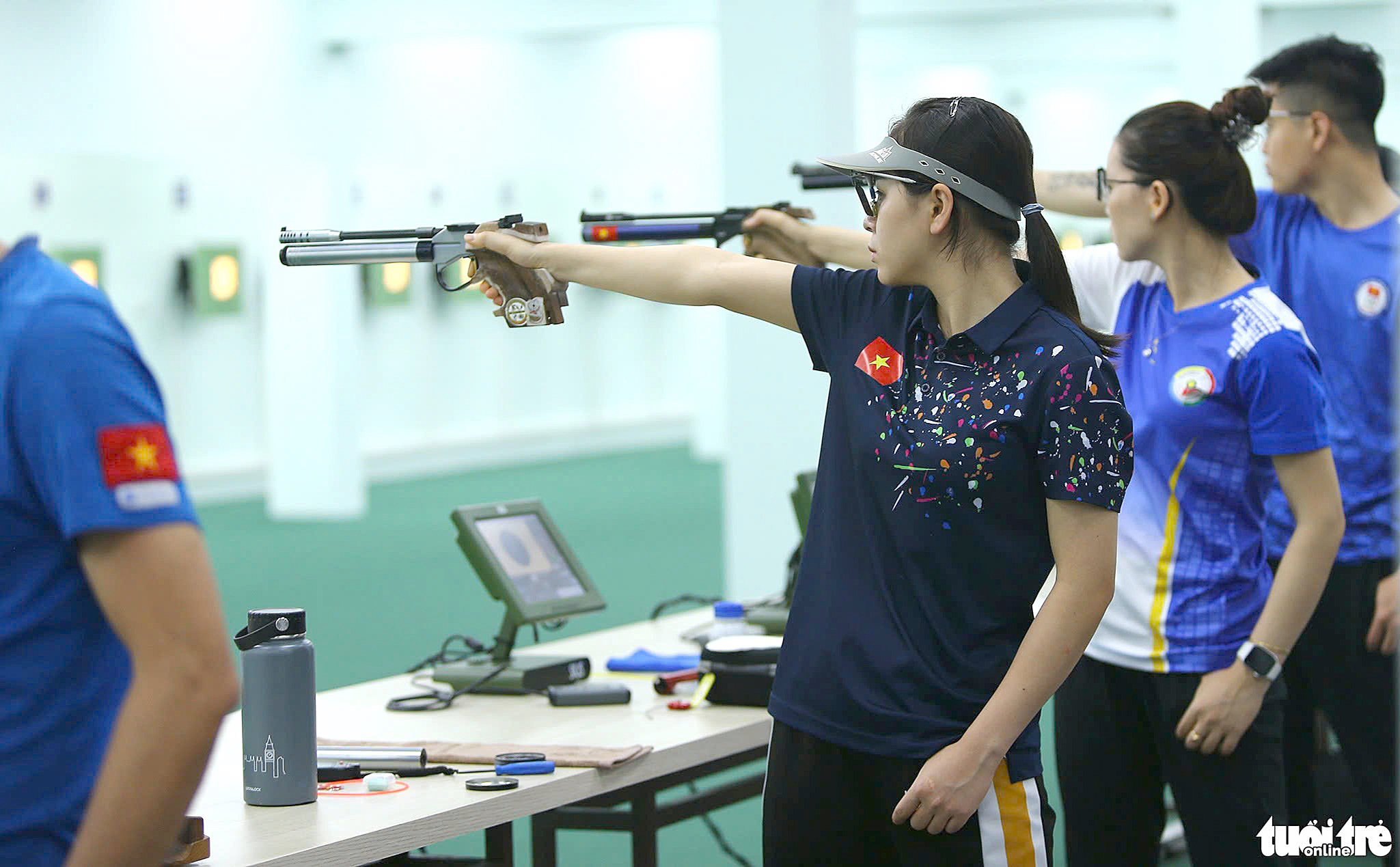 Vietnamese shooters train during a practice session. Photo: Hoang Tung / Tuoi Tre